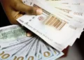 Naira gains by N1.65 against dollar at official market