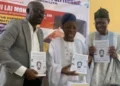 Lai Mohammed donates book to MAPOLY