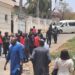 PHOTOS: EFCC operatives storm Malami’s Abuja resident in 5 buses